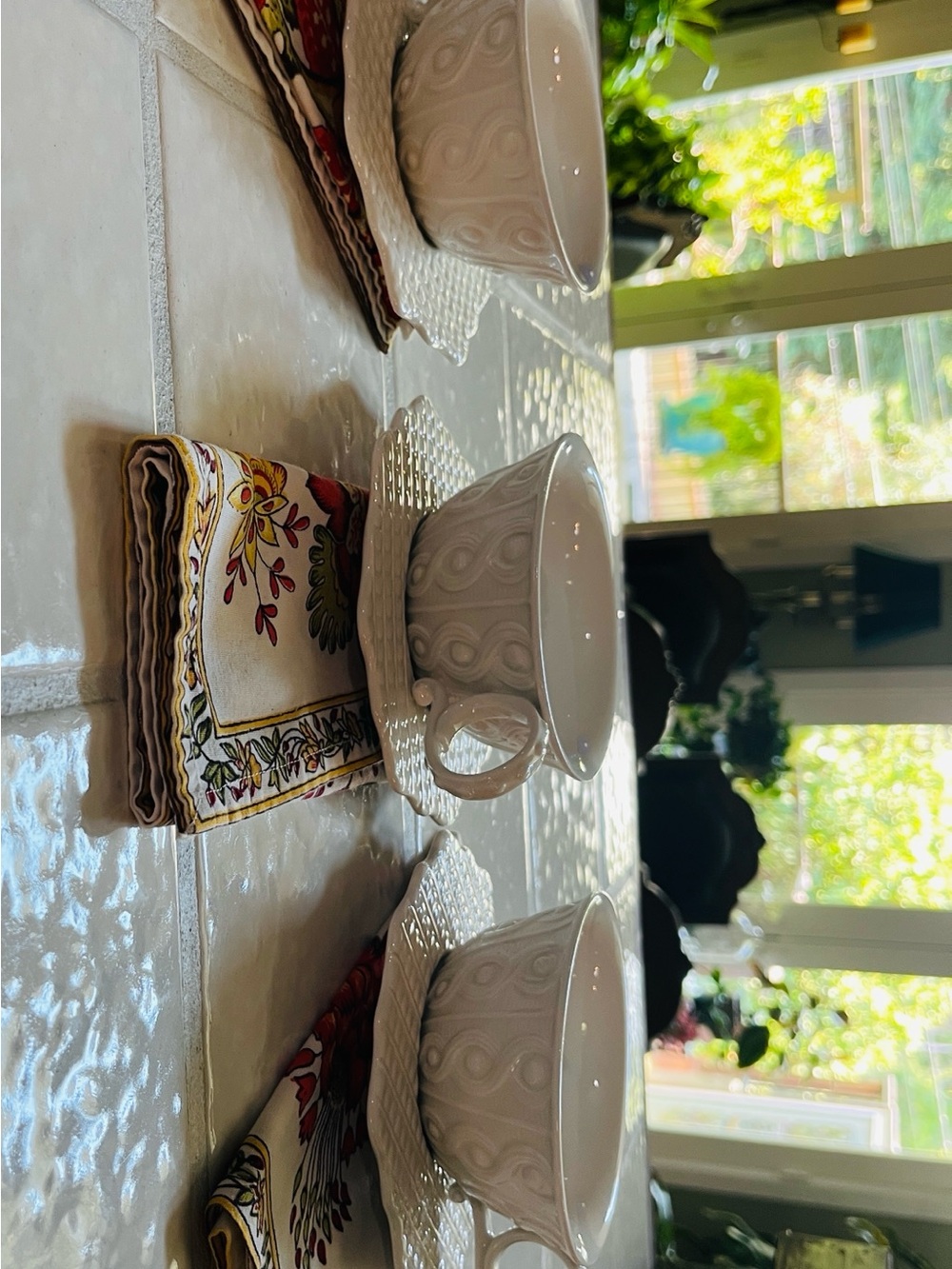 Anthropologie White Embossed Ceramic Tea Cups and Saucers